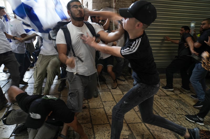 Palestinian and Jewish youths fight at Damascus Gate. AP