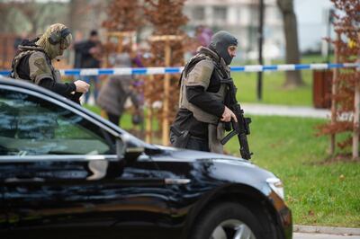 epa08058944 Armed police officers move near the crime scene in front of a hospital in Ostrava, Czech Republic, 10 December 2019. According to police, four people have been killed in a shooting at a hospital in Ostrava. Two others suffered severe injuries in the incident. The police is looking for a suspected gunman who is at large, media reported.  EPA/LUKAS KABON