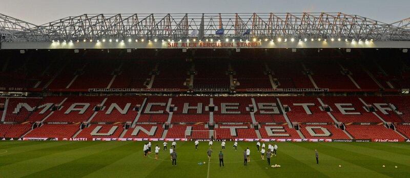 Liverpool players warm up on the pitch during a team training session at Old Trafford in Manchester, north west England, on March 16, 2016. Manchester United will play Liverpool in a Uefa Europa League second leg football match tomorrow. AFP / PAUL ELLIS