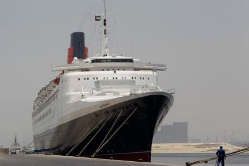 The Queen Elizabeth 2 is seen at dock as Istithmar World, the Dubai state investment company that owns the ship, outlined plans Monday to turn the retired cruise liner into a 300-room hotel, ending years of speculation about its fate, in Port Rashid, Dubai, United Arab Emirates, Monday, July 2, 2012. Britain's Queen Elizabeth II launched the QE2 in 1967. (AP Photo/Kamran Jebreili) *** Local Caption ***  Mideast Emirates Dubai QE2.JPEG-0539f.jpg