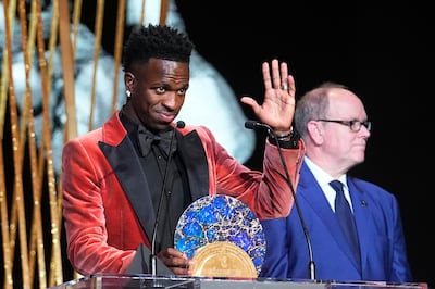 Real Madrid's Vinicius Junior, left, receives the Socrates Award from Prince Albert II of Monaco during the 67th Ballon d'Or award ceremony at Theatre du Chatelet in Paris. AP