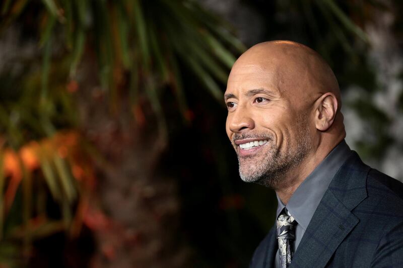 FILE PHOTO: Actor Dwayne Johnson poses for photographers as he arrives for the UK premiere of 'Jumanji: Welcome to the Jungle', at the Vue West End, Leicester Square, central London, Britain, December 7, 2017.  REUTERS/Simon Dawson/File Photo