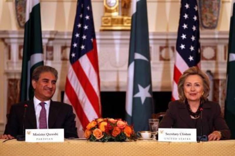 U.S. Secretary of State Hillary Clinton and Pakistan's Foreign Minister Shah Mahmood Qureshi speak during the U.S.-Pakistan Strategic Dialogue Plenary Session at the State Department in Washington October 22, 2010.     REUTERS/Larry Downing (UNITED STATES - Tags: POLITICS MILITARY) *** Local Caption ***  WAS301_USA-_1022_11.JPG