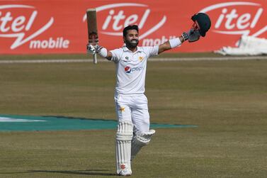 Pakistan's Mohammad Rizwan celebrates after scoring a century (100 runs) during the fourth day of the second Test cricket match between Pakistan and South Africa at the Rawalpindi Cricket Stadium in Rawalpindi on February 7, 2021. / AFP / Aamir QURESHI