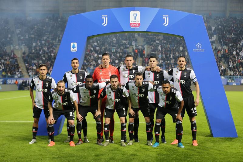 Juventus players pose for a team photo. Reuters