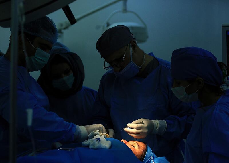 Plastic surgeon Dr Abbas al-Sahan operates on Saja Ahmed Saleem, in Baghdad, Iraq. AP Photo