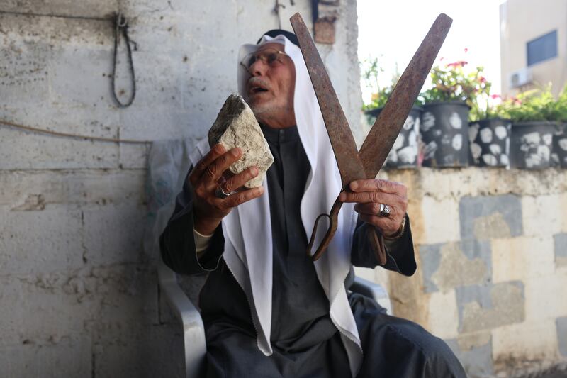 He has also kept a stone and a pair of scissors his family brought from their village of Sabarin