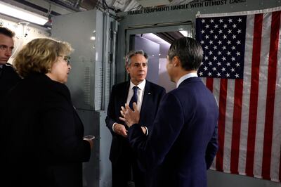 US Secretary of State Antony Blinken talks to Assistant Secretary of State for Near Eastern Affairs Barbara Leaf. second left, and spokesman Matthew Miller, right, aboard a plane after he departed from Manama for Tel Aviv during his week-long trip across the Middle East. AFP