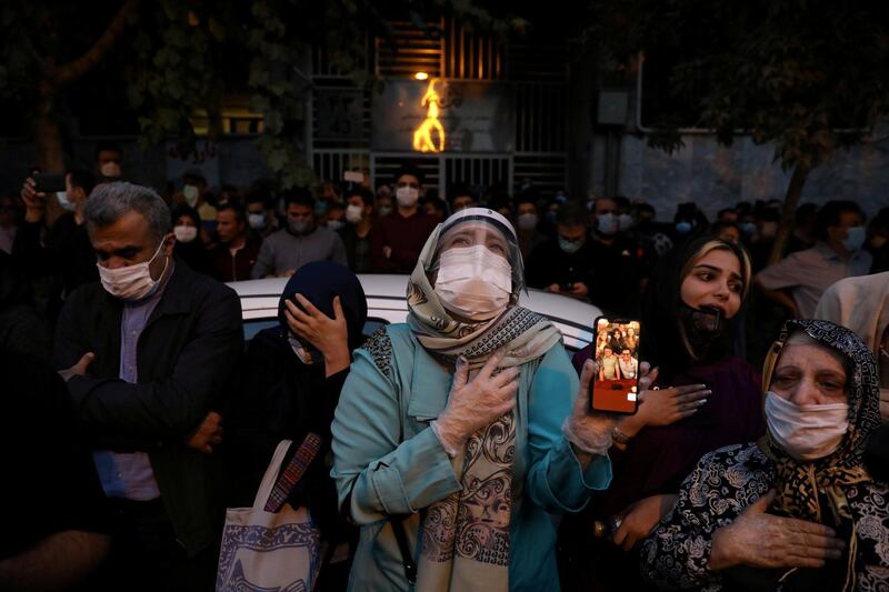 Fans of Mohammad Reza Shajarian mourn his death in front of Jam Hospital. Reuters