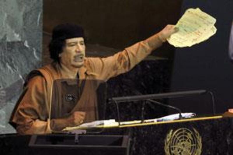 Moammar Qadafi gestures during his speech at the United Nations General Assembly in New York.