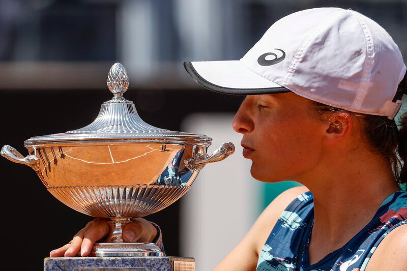 Iga Swiatek the trophy after beating Ons Jabeur in Rome. EPA