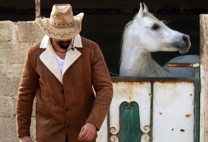 Abdul Salam Al Worfali at his stable in Benghazi. AFP