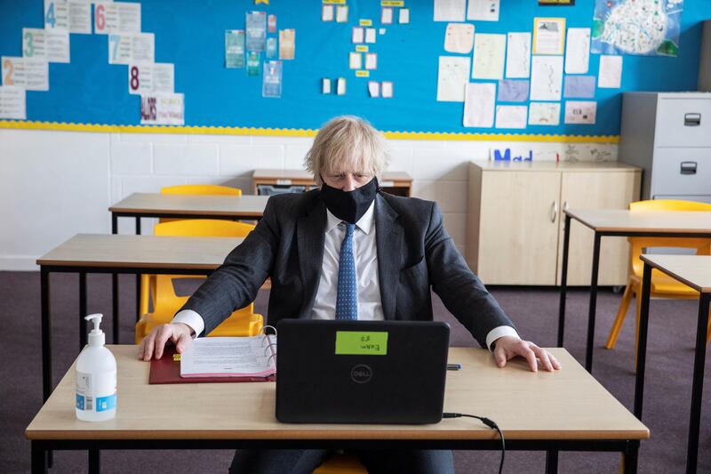 Boris Johnson takes part in an online class during his visit. Reuters