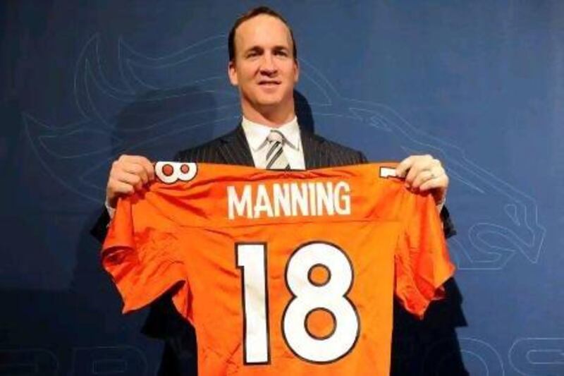 Peyton Manning signed up for Denver Broncosduring a news conference last week.
