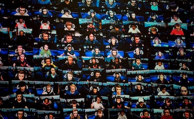 (FILES) In this file photo taken on July 28, 2019 the players are seen on a TV screen during the final of the Solo competition at the 2019 Fortnite World Cup inside of Arthur Ashe Stadium, in New York City. Internet gaming phenomenon Fortnite has temporarily gone offline, leaving millions of addicted gamers wondering what to do with themselves, after a massive asteroid brought the latest season to an end. Epic Games, Fortnite's creators, announced that season ten of the shoot-'em-up survival video game would end on October 13, 2019 and many users expected season eleven to follow immediately. / AFP / Johannes EISELE
