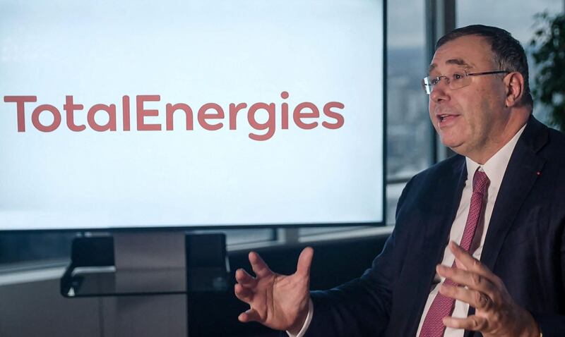 (FILES) This File handout video grab released by the French oil giant Total on February 9, 2021, shows its Chief Executive Officer (CEO) Patrick Pouyanne delivering a speech for the group's employees next to the logo of the future name of the company "TotalEnergies" in La Defense, outside Paris. Total shareholders are voting on May 8, 2021 on the strategy of the oil and gas giant, which is renaming itself TotalEnergies to mark its diversification, while some investors are urging it to act more quickly. - RESTRICTED TO EDITORIAL USE - MANDATORY CREDIT "AFP PHOTO / TOTAL" - NO MARKETING - NO ADVERTISING CAMPAIGNS - DISTRIBUTED AS A SERVICE TO CLIENTS
 / AFP / TOTAL / Handout / RESTRICTED TO EDITORIAL USE - MANDATORY CREDIT "AFP PHOTO / TOTAL" - NO MARKETING - NO ADVERTISING CAMPAIGNS - DISTRIBUTED AS A SERVICE TO CLIENTS

