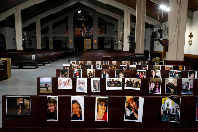 Portraits of congregation members are displayed on the benches of San Miguel Arcangel Catholic temple after priest Jorge Echegollen decided to use them to motivate himself during online masses in Tijuana, Mexico.  AFP