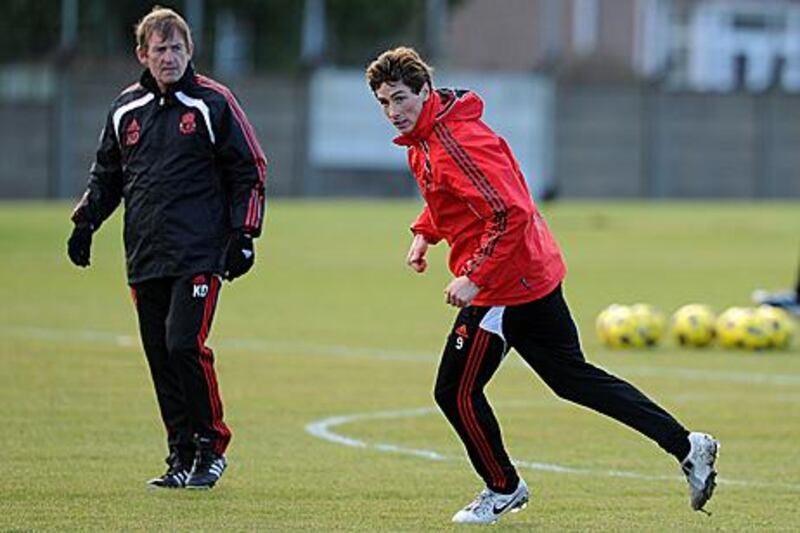 Kenny Dalglish, left, watches Fernando Torres, who will be key to Liverpool's hopes against Everton with Steven Gerrard suspended.