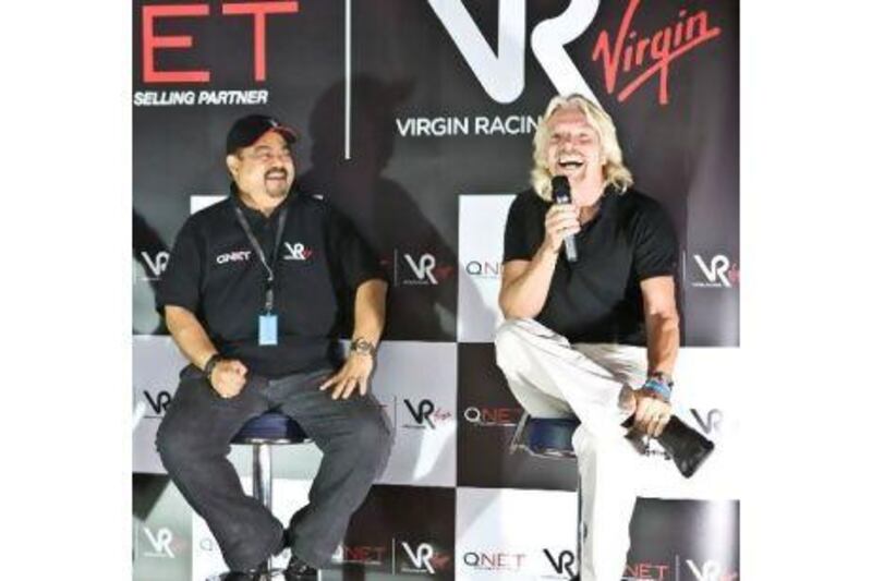 Richard Branson, right, with Vijay Eswaran, the executive chairman of the QI Group, at Yas Marina.