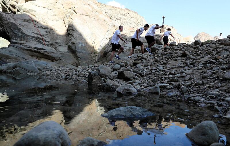 FUJAIRAH , UNITED ARAB EMIRATES , March 4 – 2019 :- Left to Right – Gary Fournier , Hung Chow, Special Olympics athlete , Allen Jones from Law Enforcement Torch Run and Delia Newman with the Special Olympics torch “Flame of Hope” in Wadi Al Wurayah Waterfalls in Fujairah. ( Pawan Singh / The National )
For News/Online/Instagram/Big Picture. Story by Ruba
