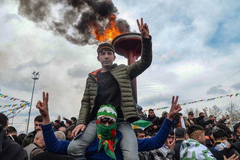 The first day of spring is marked with bonfires by a gathering of Turkish Kurds to celebrate Nowruz, the Persian New Year, in Diyarbakir, southeastern Turkey. AFP