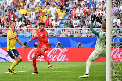 England's midfielder Dele Alli (C) heads the ball to score his team's second goal during the Russia 2018 World Cup quarter-final football match between Sweden and England at the Samara Arena in Samara on July 7, 2018. (Photo by Yuri CORTEZ / AFP) / RESTRICTED TO EDITORIAL USE - NO MOBILE PUSH ALERTS/DOWNLOADS