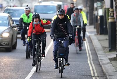 Mayor of London Sadiq Khan arrives on a bicycle to the Millbank studios in London, as he prepares to announce plans for new road user charges in London. PA