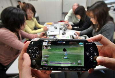 Women in Japan play with PSPs in a 'brain training' programme in Yokohama in March 2006. Reuters 