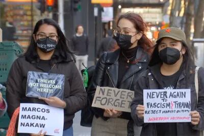 Members of Australia’s Filipino community protest outside an apartment in Melbourne, Australia, where Ferdinand Marcos Jr, was believed to be holidaying. AP
