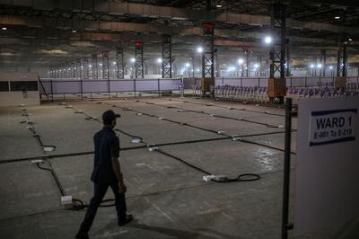 An under construction ward in a quarantine center at the Goregaon NESCO jumbo Covid centre in the Goregaon suburb of Mumbai, India, on Tuesday, April 27, 2021. India's spike in virus numbers has prompted state governments to impose movement curbs, which in turn have tamped down economic activity as well as stoked price pressures because of broken supply chains. Photographer: Dhiraj Singh/Bloomberg