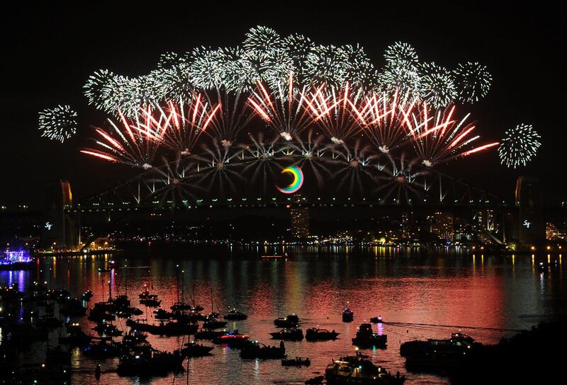 A kaleidoscope of fireworks explode over the Sydney Harbour Bridge on January 1, 2012. Over one and a half million Sydneysiders lined the harbour vantage points to watch the spectacular pyrotechnic display usher in the New Year.  AFP PHOTO / Torsten BLACKWOOD
 *** Local Caption ***  559805-01-08.jpg