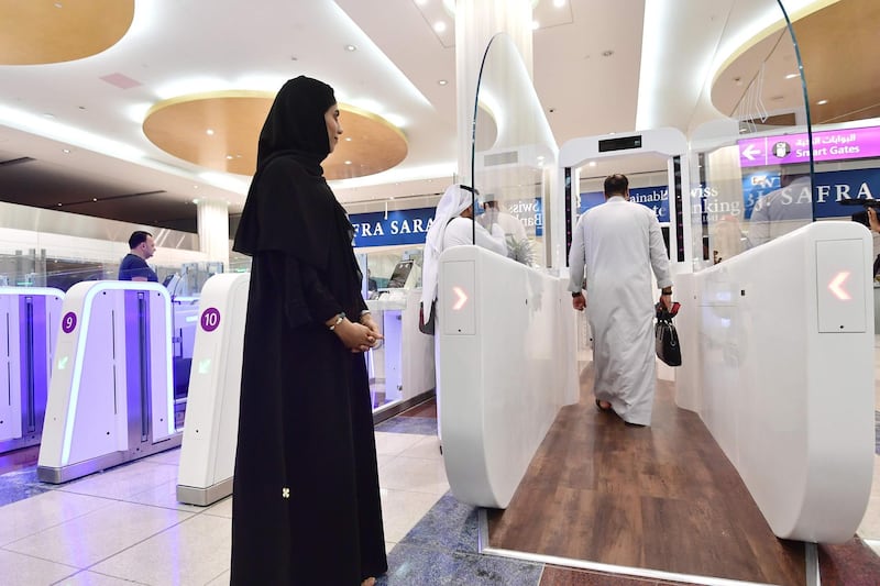 A passengers walks through a "smart tunnel" at Terminal 3 of Dubai International Airport. AFP