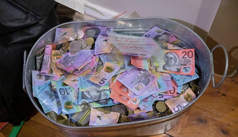Money seized by Australian Federal Police are seen after its Operation Ironside against organised crime in this undated handout photo released June 8, 2021.   Australian Federal Police/Handout via REUTERS   ATTENTION EDITORS - THIS IMAGE HAS BEEN SUPPLIED BY A THIRD PARTY. MANDATORY CREDIT. MUST CREDIT “AUSTRALIAN FEDERAL POLICE”. NO RESALES. NO ARCHIVES.