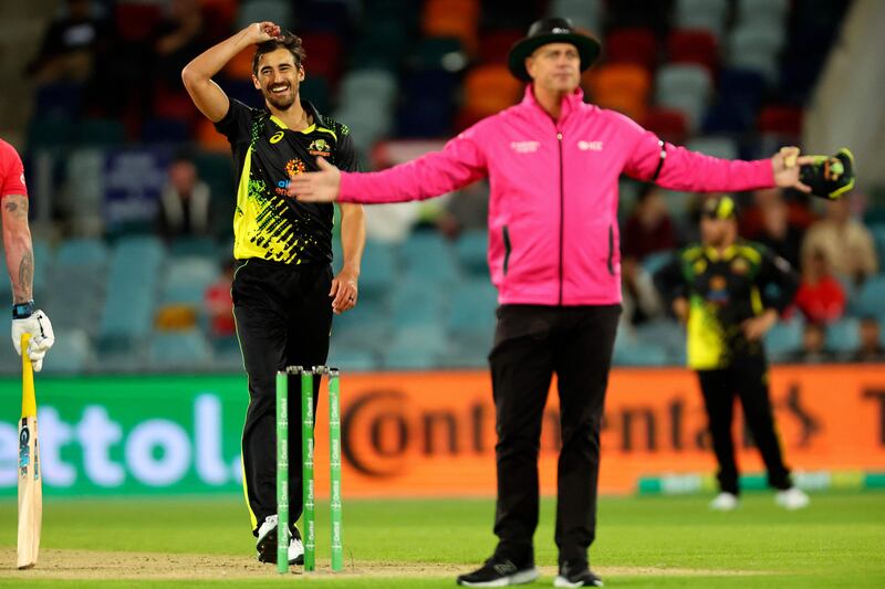Australian pacer Mitchell Starc smiles as the umpire signals a wide. AFP
