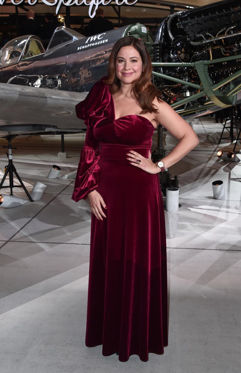 Lebanese TV presenter Raya Abirached in a red velvet dress by Beirut designer Caramel by Noor Azhari. Photo: Getty