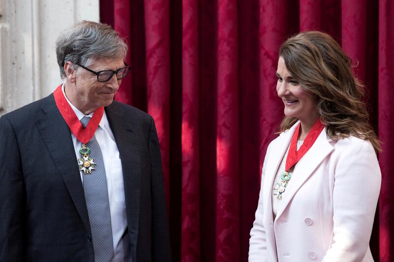 Philanthropist and co-founder of Microsoft, Bill Gates and his wife Melinda talk, after being awarded Commanders of the Legion of Honor at the Elysee Palace in Paris, France, April 21, 2017. Reuters