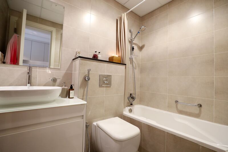 The modest studio flat has a full bath and shower.