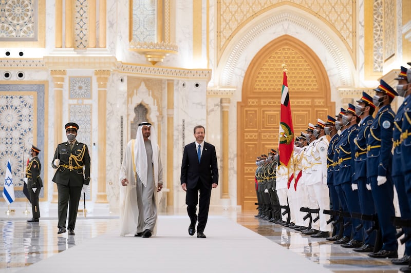 Sheikh Mohamed and Isaac Herzog inspect the UAE honour guard at Qasr Al Watan. Mohamed Al Hammadi / Ministry of Presidential Affairs