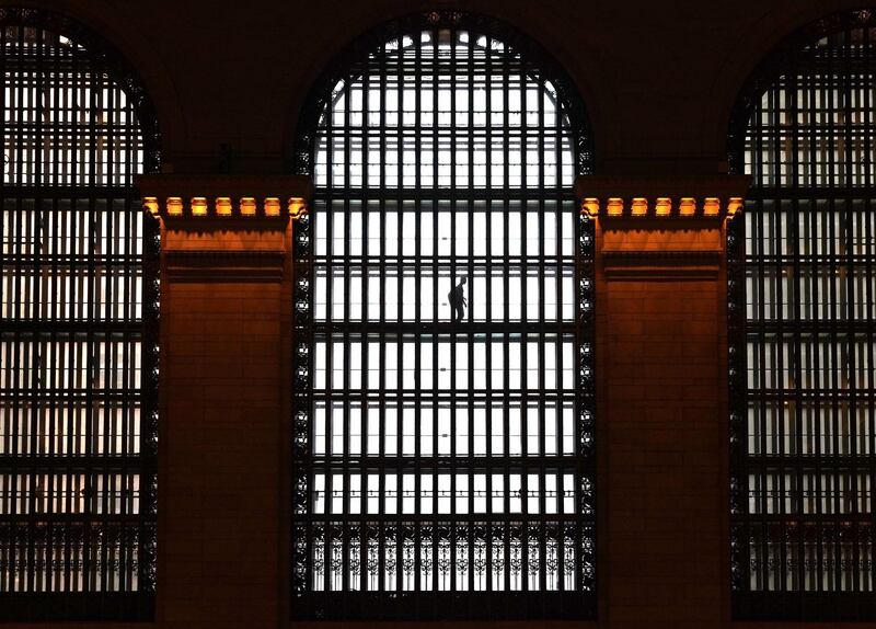A person makes his way on one of the elevated glass walkways at Grand Central Terminal in New York City, USA. Timothy A. Clary / AFP Photo