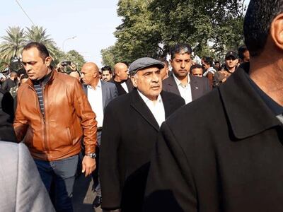 A handout picture released by Iraq's Hashed al-Shaabi paramilitary force on January 4, 2020, shows Iraq's caretaker prime minister Adel Abdel Mahdi (C-R) arriving for the funeral of Iranian military commander Qasem Soleimani and Iraqi paramilitary chief Abu Mahdi al-Muhandis in Baghdad's district of al-Jadriya, in Baghdad's high-security Green Zone. Thousands of Iraqis chanting "Death to America" joined the funeral procession for Iranian commander Qassem Soleimani and Iraqi paramilitary chief Abu Mahdi al-Muhandis, both killed in a US air strike. The cortege set off around Kadhimiya, a Shiite pilgrimage district of Baghdad, before heading to the Green Zone government and diplomatic district where a state funeral was to be held attended by top dignitaries. In all, 10 people -- five Iraqis and five Iranians -- were killed in Friday morning's US strike on their motorcade just outside Baghdad airport. - === RESTRICTED TO EDITORIAL USE - MANDATORY CREDIT "AFP PHOTO / HO /HASHED AL-SHAABI MEDIA OFFICE" - NO MARKETING NO ADVERTISING CAMPAIGNS - DISTRIBUTED AS A SERVICE TO CLIENTS ===
 / AFP / Hashed al-Shaabi Media / - / === RESTRICTED TO EDITORIAL USE - MANDATORY CREDIT "AFP PHOTO / HO /HASHED AL-SHAABI MEDIA OFFICE" - NO MARKETING NO ADVERTISING CAMPAIGNS - DISTRIBUTED AS A SERVICE TO CLIENTS ===

