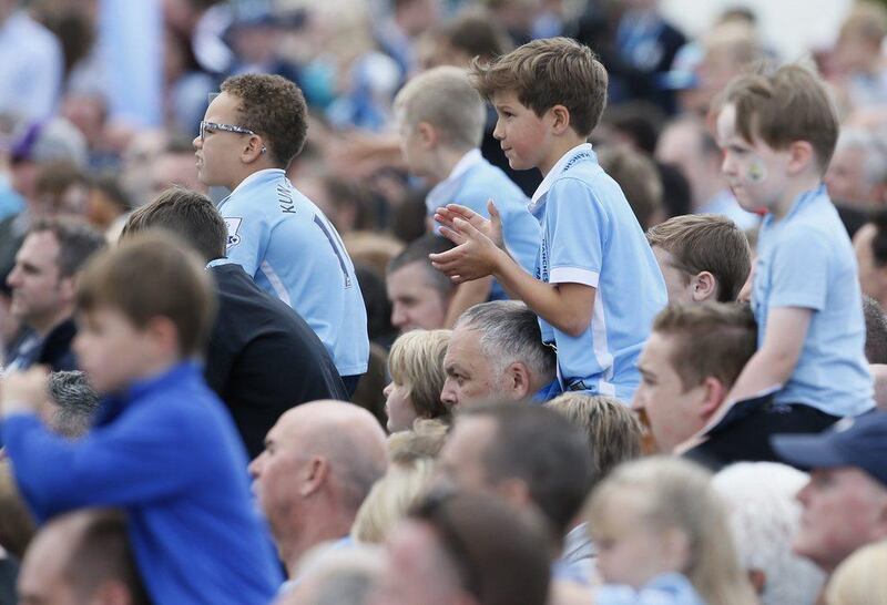 Manchester City fans wait for Pep Guardiola to be presented at the City Football Academy. Craigh Brough / Action Images / Reuters