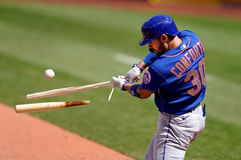 Hit single ... New York Mets' Michael Conforto, despite breaking his bat, manages to hit a single during the eighth inning of a baseball game against the S. Louis Cardinals in St Louis. AP Photo