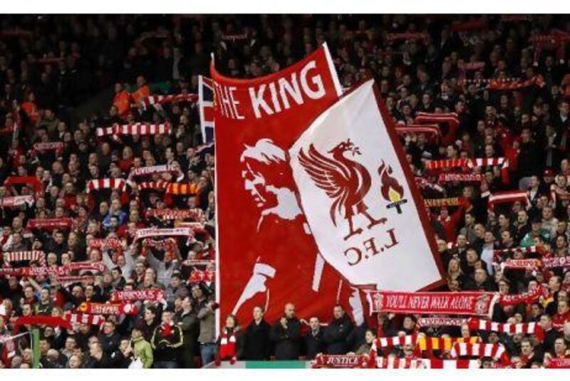 Liverpool fans hold up flags and banners as Kenny Dalglish returned to Anfield for yesterday’s derby against Everton.