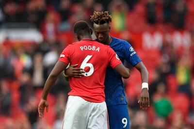 Manchester United's French midfielder Paul Pogba ebraces Chelsea's English striker Tammy Abraham (R) on the pitch at the final whistle in the English Premier League football match between Manchester United and Chelsea at Old Trafford in Manchester, north west England, on August 11, 2019. Manchester United won the game 4-0. - RESTRICTED TO EDITORIAL USE. No use with unauthorized audio, video, data, fixture lists, club/league logos or 'live' services. Online in-match use limited to 120 images. An additional 40 images may be used in extra time. No video emulation. Social media in-match use limited to 120 images. An additional 40 images may be used in extra time. No use in betting publications, games or single club/league/player publications.
 / AFP / Oli SCARFF                           / RESTRICTED TO EDITORIAL USE. No use with unauthorized audio, video, data, fixture lists, club/league logos or 'live' services. Online in-match use limited to 120 images. An additional 40 images may be used in extra time. No video emulation. Social media in-match use limited to 120 images. An additional 40 images may be used in extra time. No use in betting publications, games or single club/league/player publications.
