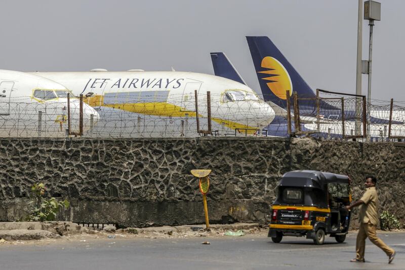 Jet Airways India Ltd. aircraft sit on the tarmac at Chhatrapati Shivaji Maharaj International Airport in Mumbai, India, on Monday, April 15, 2019. Jet Airways' fleet has shrunk by almost 90 percent as the cash-strapped airline struggles to find funds to operate, forcing the nation’s oldest surviving private airline to drastically curtail its scheduled flights amid a hunt for a new investor. Photographer: Dhiraj Singh/Bloomberg