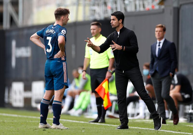 Arsenal manager Mikel Arteta gives instructions to Kieran Tierney. PA