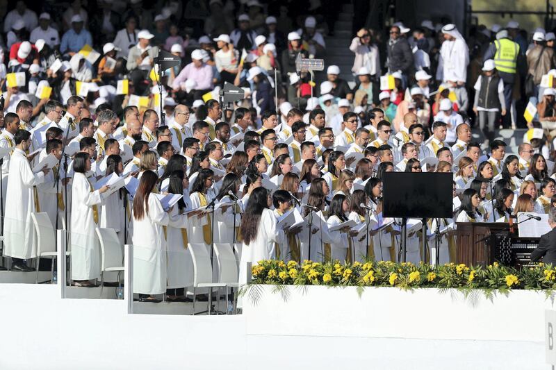Abu Dhabi, United Arab Emirates - February 05, 2019: The choir sings. Pope Francis takes a large public mass to mark his land mark visit to the UAE. Tuesday the 5th of February 2019 at Zayed Sports city stadium, Abu Dhabi. Chris Whiteoak / The National
