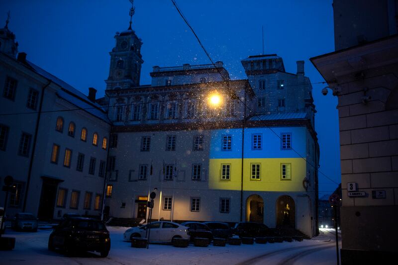 A Vilnius University building is illuminated in blue and yellow in support of Ukraine, in Vilnius, Lithuania. AP