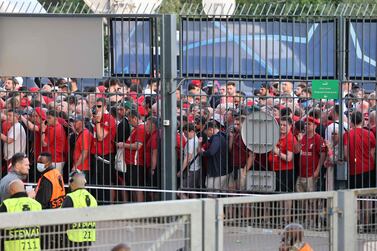 Liverpool fans stand outside prior to the UEFA Champions League final football match between Liverpool and Real Madrid at the Stade de France in Saint-Denis, north of Paris, on May 28, 2022.  (Photo by Thomas COEX  /  AFP)