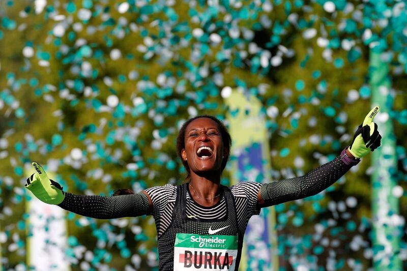 Gelete Burka celebrates winning the women's elite race in the Paris Marathon. Reuters